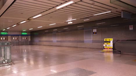 a serene journey through an empty bangkok mrt station, focusing on escalator movement and architectural details under soft lighting