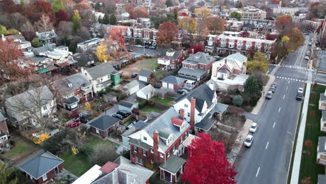 aerial establishing shot revealing town during autumn