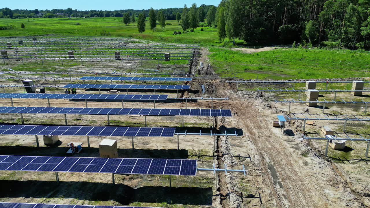 Construction site of renewable solar panel plant, aerial view