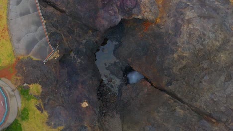 Top-View-Of-Wave-Spray-In-Blowhole-In-Kiama,-New-South-Wales,-Australia