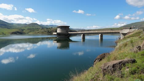 hydro electric power: water intake in picturesque man-made reservoir