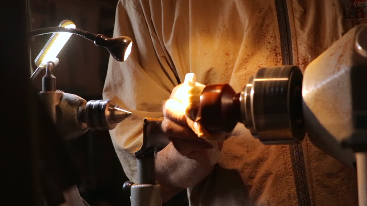 Craftsman using wood lathe for woodturning