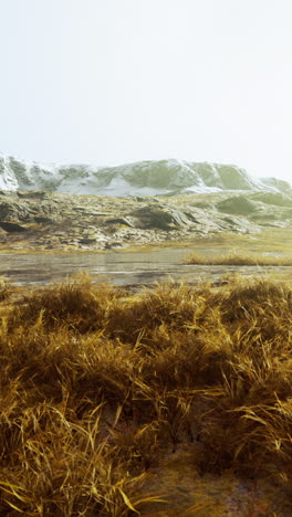 serene winter landscape: snow-capped mountains and frozen lake