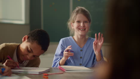 clever schoolboys and schoolgirls studying science together at school