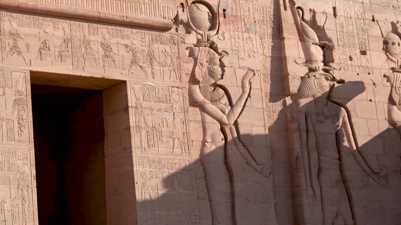 Detail of hieroglyphs on the entry to the ancient temple Philae in Aswan, Egypt.