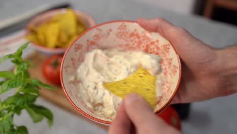 creamy cheese with tomato and basil dipping for nachos