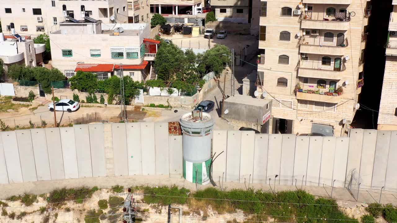 Aerial View of a Security Wall and Watchtower in an Urban Residential Area