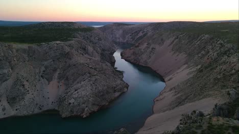 Drone-shot-of-the-meandering-river-at-the-edge-of-the-Zrmanja-gorge-in-Jasenice,-Zadar-County,-Croatia