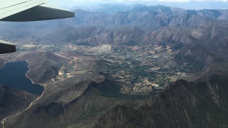 Aerial-Drone-shot-of-mountain-ranges-from-a-plane