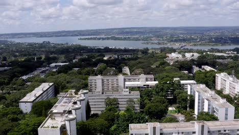 superquadras,apartment buildings with lake paranoá on the horizon, brasilia, pull back aerial