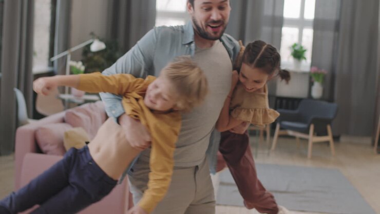 Father playing with children