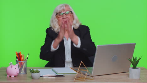 senior office business woman showing thumbs up and nodding in approval successful good nice job work