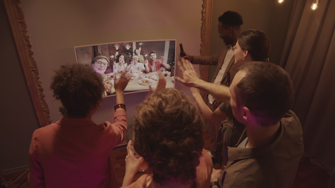 Two Groups of Friends Celebrating Together by Video Chat