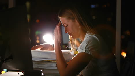 Businesswoman-sleeping-on-documents