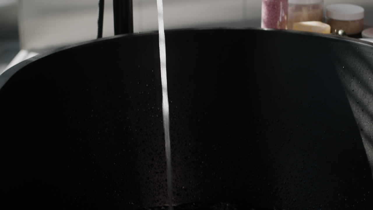 Filling a Black Tub with Water