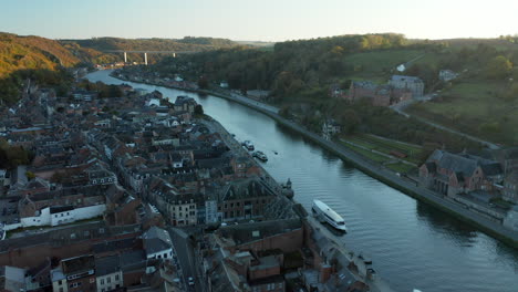 drone shot of dinant city in belgium’s walloon region in meuse riverbank