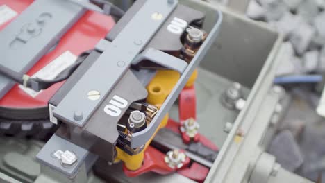 close-up of a rail clamp device on a railway, showcasing intricate mechanical details