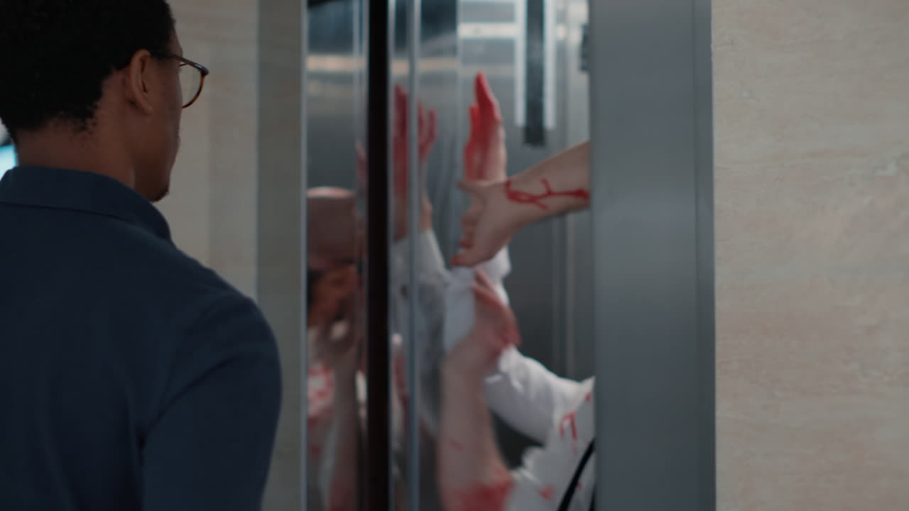 Confident man encountering evil zombies at elevator when leaving work