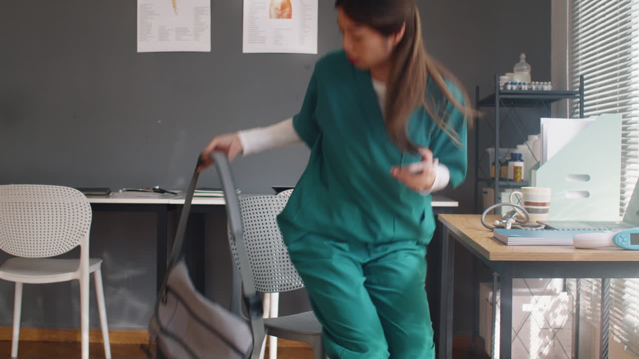 Asian Nurse Leaving Hospital after Shift