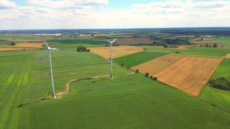 Aerial-view-of-powerful-Wind-turbine-farm-for-energy-production-on-beautiful-cloudy-sky-at-highland