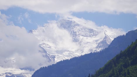 Dramatic-snow-covered-Alps-in-Switzerland-with-mysterious-clouds