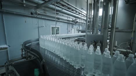 conveyor belt with bottles of drinking water at a modern beverage plant