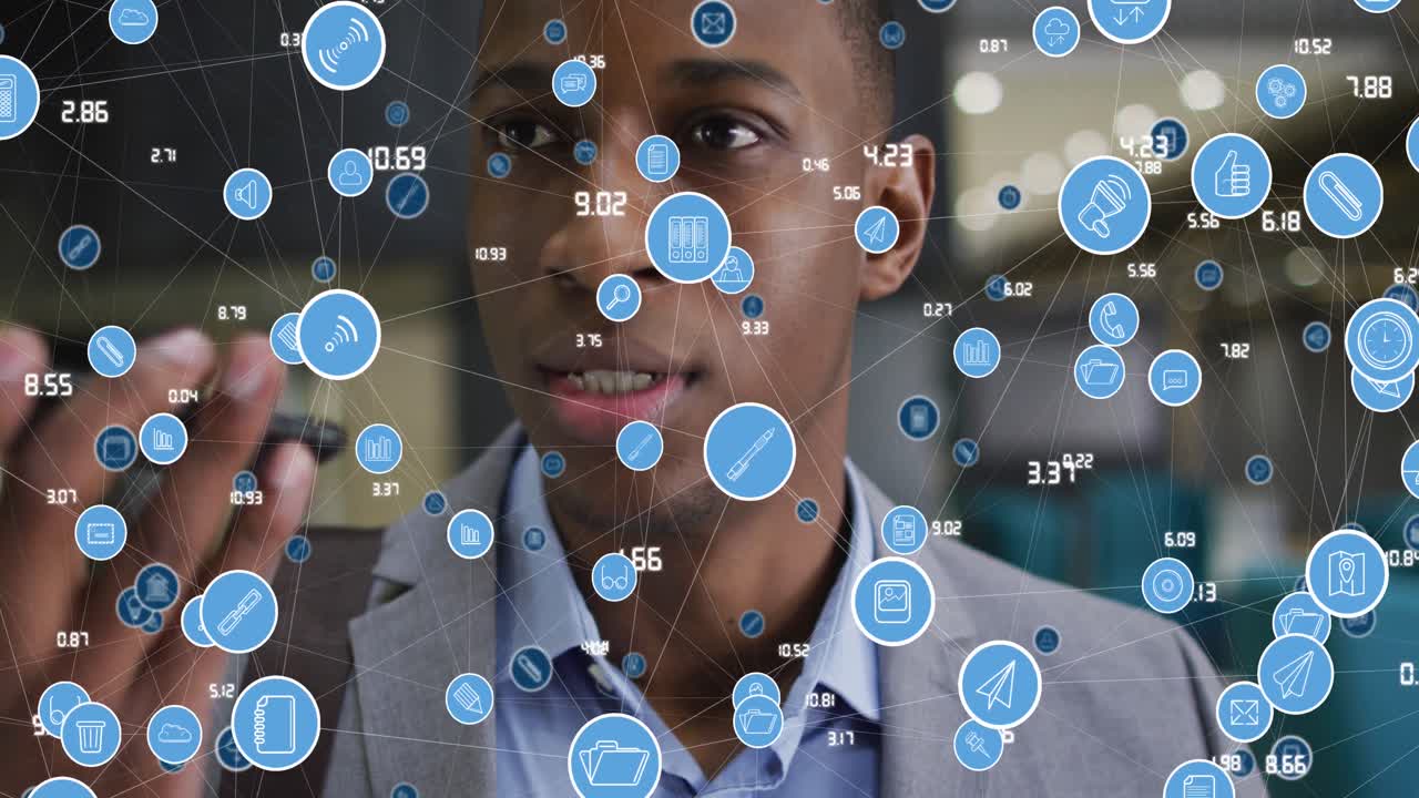 Animation of media icons over african american businessman in office