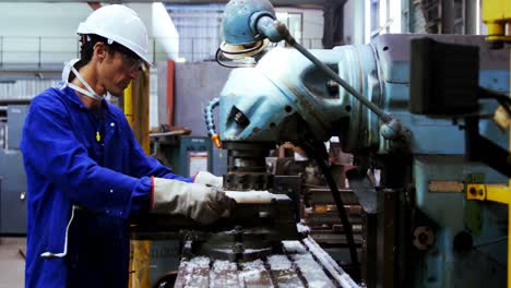 male engineer working on a machine 4k