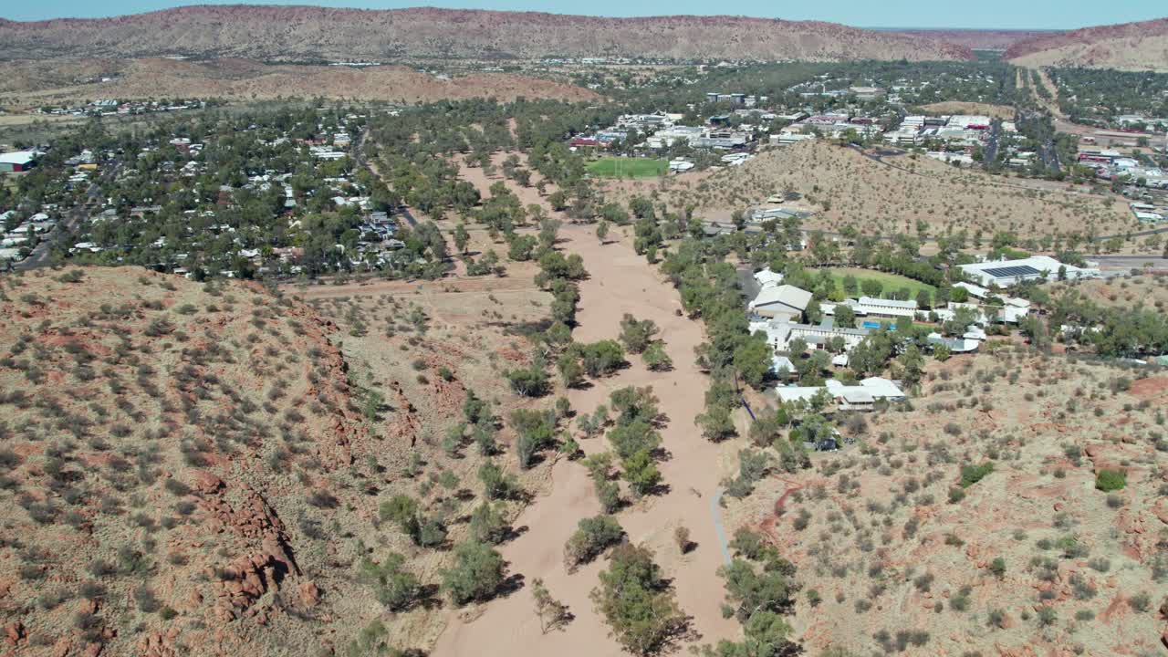 Aerial view of the dry Todd River as it winds its way through Alice Springs, Mparntwe, Northern Territory, Australia. August 2022.