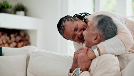 hug, love and senior couple in home on sofa