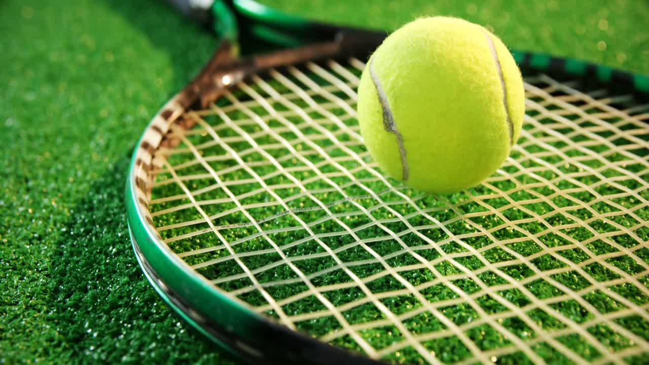 Close-up of tennis ball on racket 4k