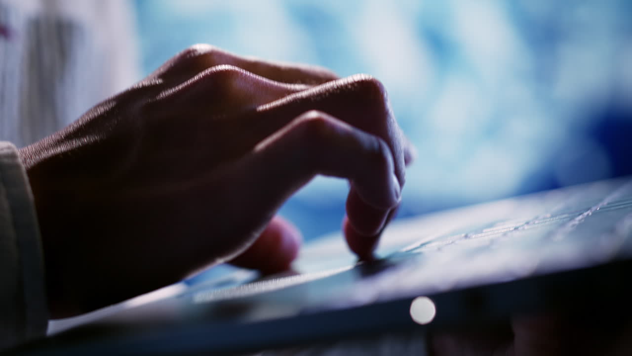 Admin typing on laptop, close up