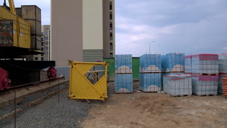 construction site with crane and building materials