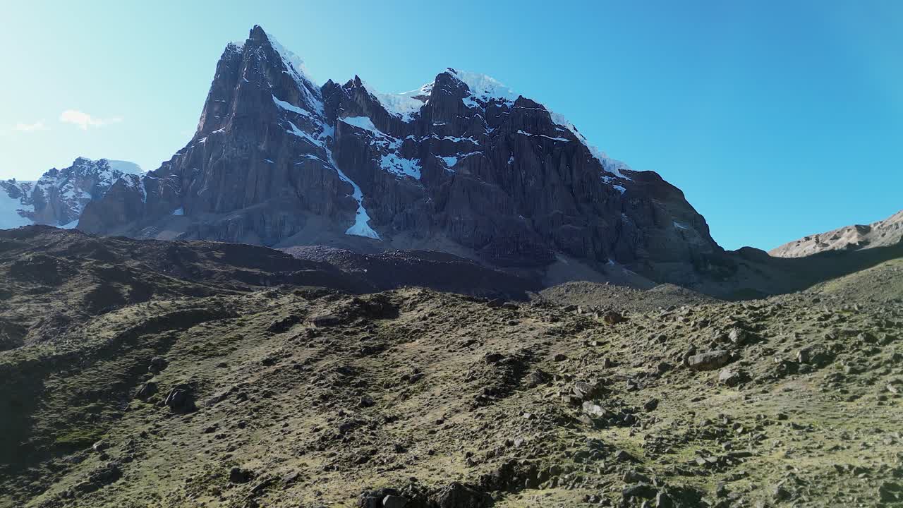 Flyover rugged talus terrain of Elefante Pampa toward Peru mtn peak