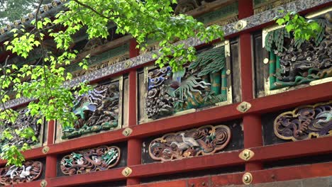 large carving wall at the toshogu shrine temple in nikko, japan