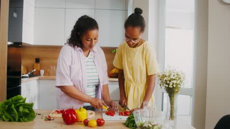 mother and daughter cooking together