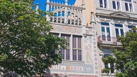 tourists gather outside the famous livraria lello bookstore in porto on a sunny day
