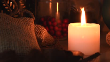 relaxing background detail shot of an herbal tea shop, with candles with flickering flames, herbs, jars and small bags