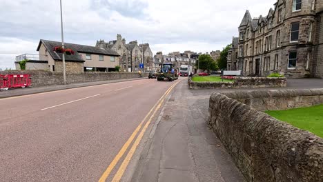 vehicles passing through historic st andrews street