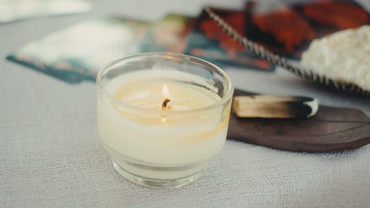 Burning Candle and Incense on an Altar