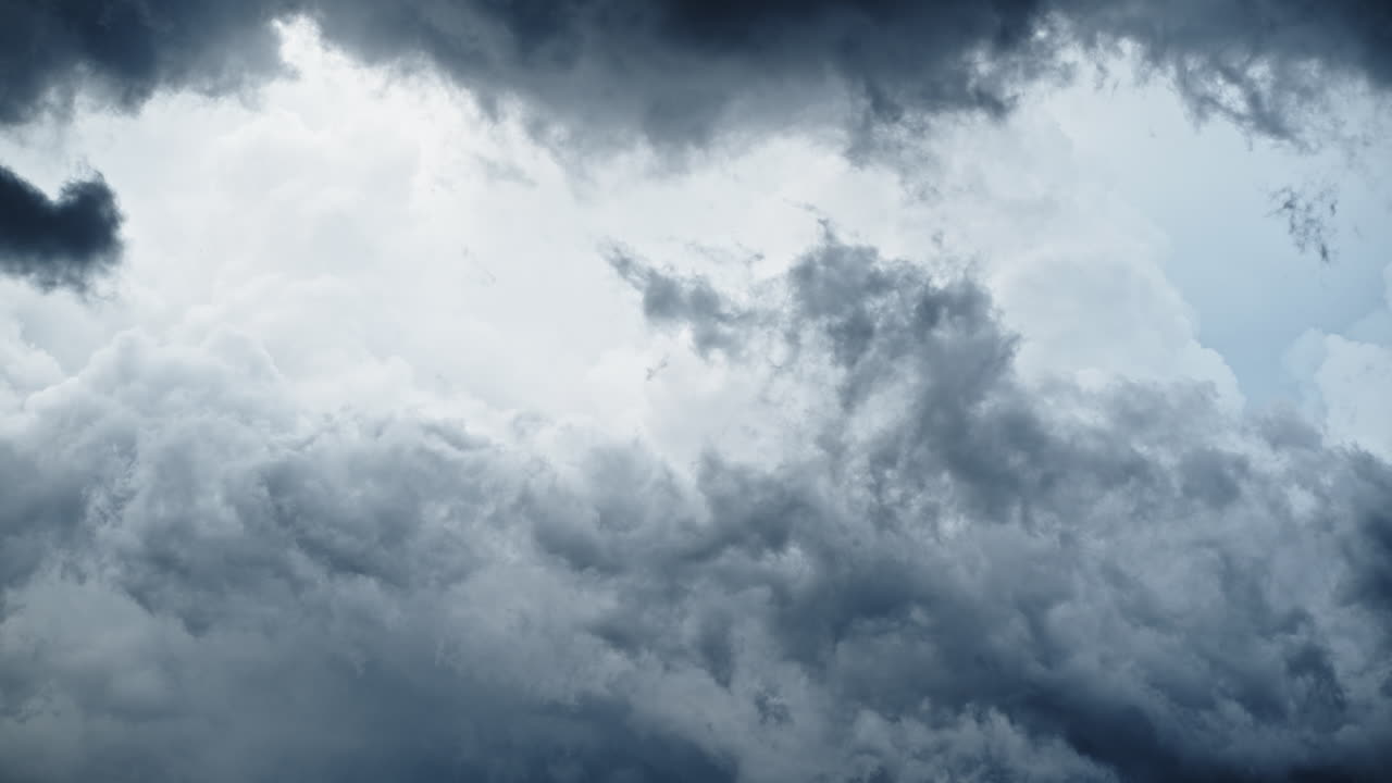 Dramatic clouds moving fast in sky, creating intense mood