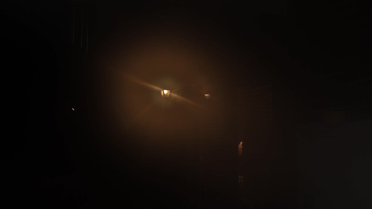 Mysterious Night Scene with Fog and Streetlight