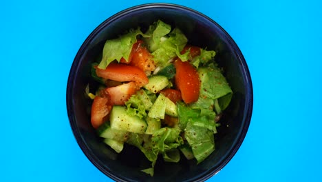 vegetarian and, organic food concept. vegetable salad or mediterranean salad. tomato, cucumber, lettuce leaves and spices paprika rotate