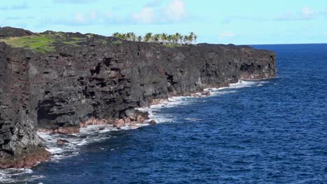 sunny coastline of hawaii volcanoes national park near holei sea arch