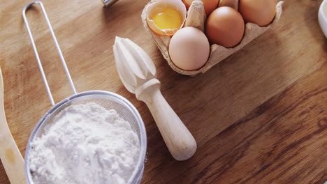 various ingredients and kitchen appliance on wooden table 4k