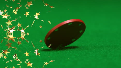 composite video of golden star icons falling against close up of poker chip on green surface