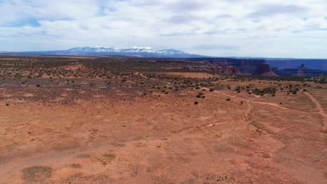 aerial drone shot over the desert of utah with canyon national park