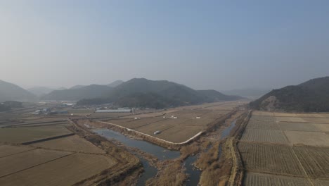 Drone-shot-flying-over-rural-nature-in-Goheung-County,-South-Korea