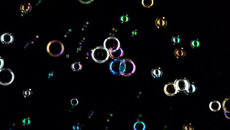 soap bubbles are flying fast slow motion black backgrounds bright and small soap bubbles fly fast slow motion black backgrounds