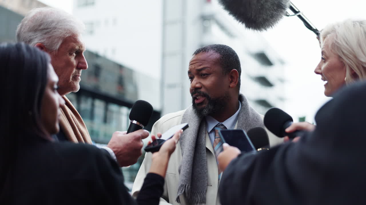 Press Conference with a Man Surrounded by Journalists